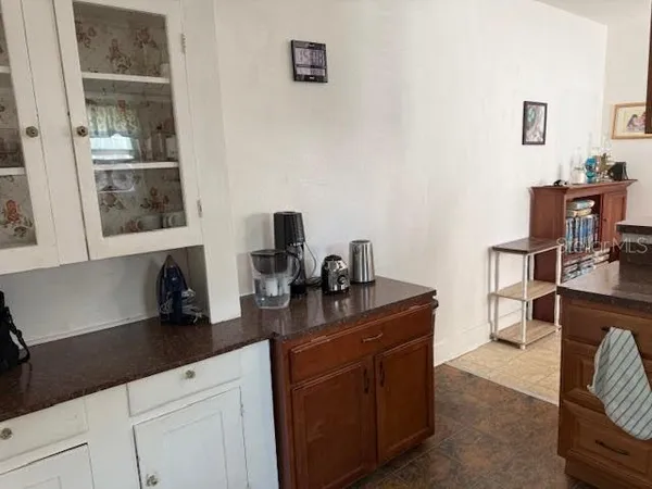 a kitchen with a sink cabinets and appliances