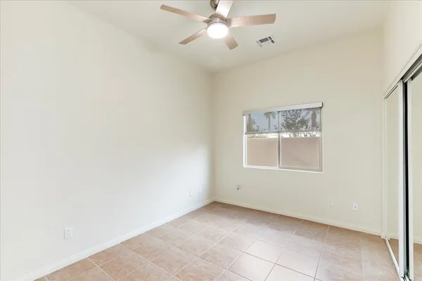 an empty room with fan