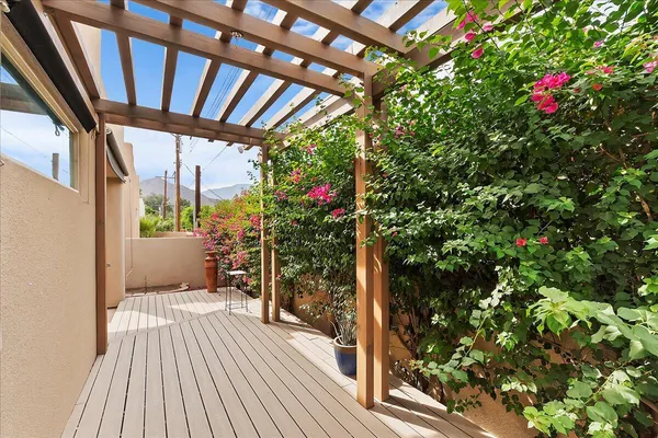 a view of a balcony with wooden floor