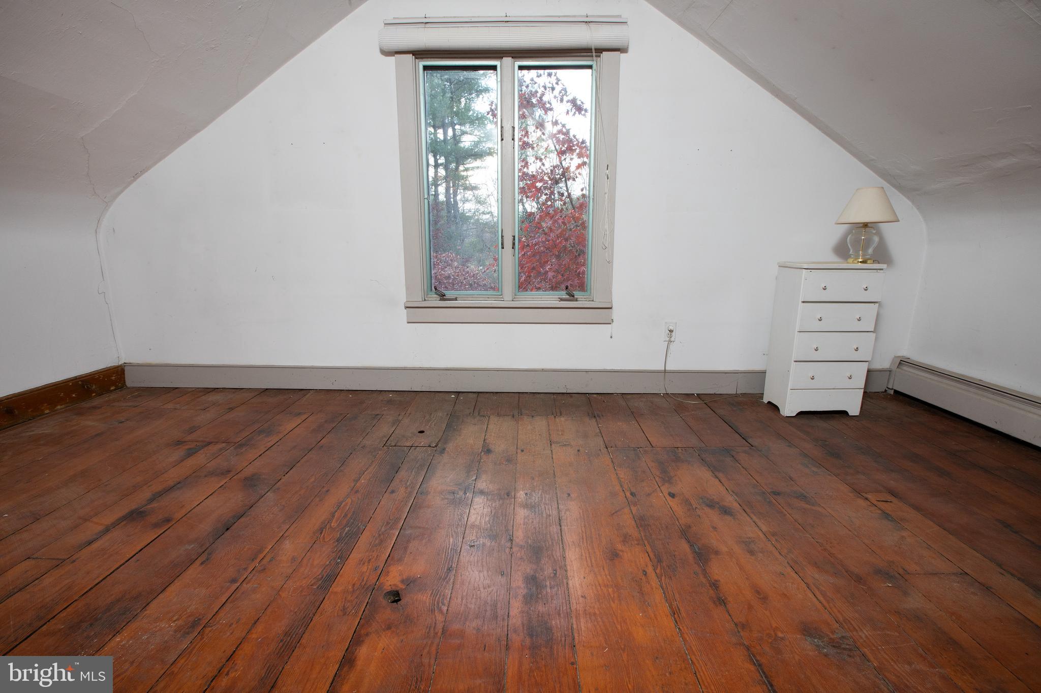 1336 River Road New Hope, PA 18938 - Photo 23 of 30 a view of empty room with wooden floor and fan