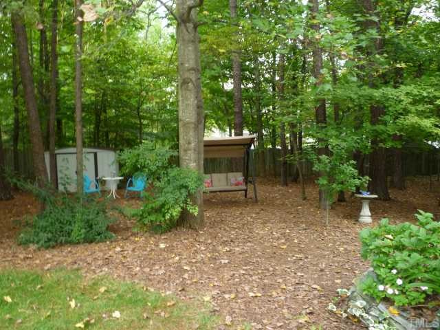 6424 Wynbrook Way Raleigh, NC 27612 - Photo 12 of 12 a view of a house with a yard and a tree