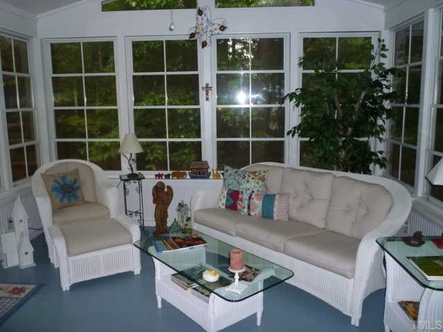 6424 Wynbrook Way Raleigh, NC 27612 - Photo 3 of 12 a living room with furniture and a potted plant