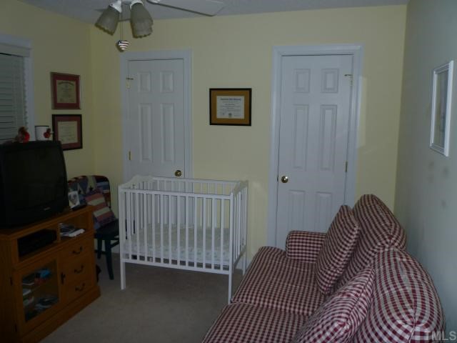 6424 Wynbrook Way Raleigh, NC 27612 - Photo 10 of 12 a bedroom with a bed and a window
