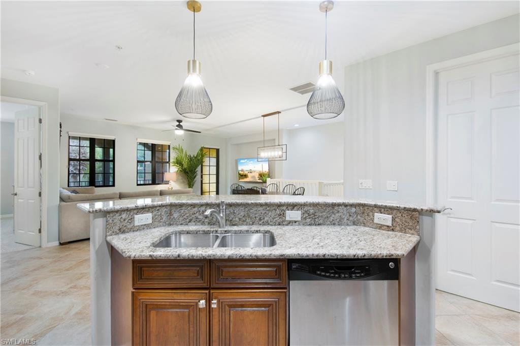 8975 Malibu Street, Unit 1304 Naples, FL 34113 - Photo 11 of 43 a view with granite countertop a sink and chandelier