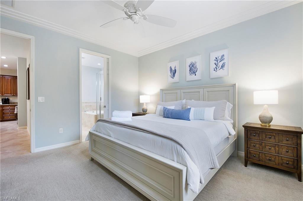 8975 Malibu Street, Unit 1304 Naples, FL 34113 - Photo 15 of 43 a bedroom with a bed and a cabinets