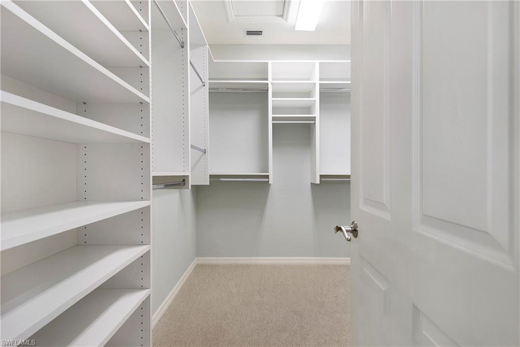 8975 Malibu Street, Unit 1304 Naples, FL 34113 - Photo 19 of 43 a view of closet area with empty racks