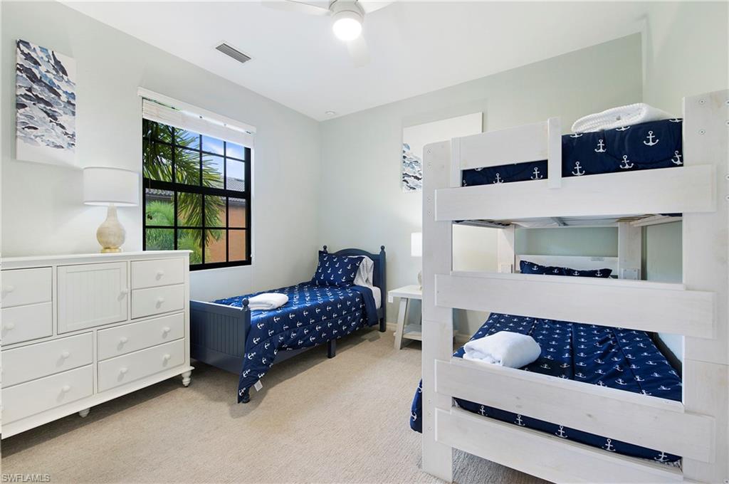 8975 Malibu Street, Unit 1304 Naples, FL 34113 - Photo 20 of 43 a bedroom with furniture and window