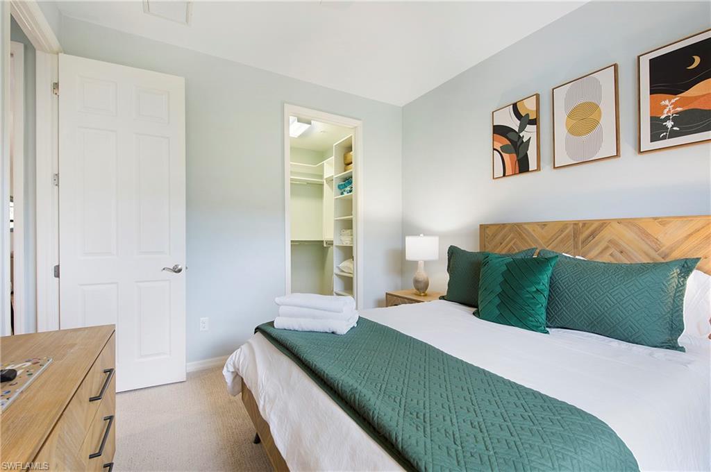 8975 Malibu Street, Unit 1304 Naples, FL 34113 - Photo 23 of 43 a bedroom with a bed and window