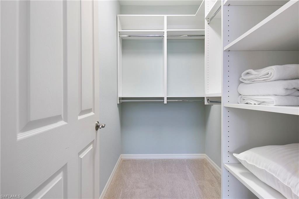 8975 Malibu Street, Unit 1304 Naples, FL 34113 - Photo 24 of 43 a view of an empty walk in closet