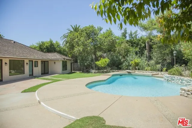 a view of outdoor space swimming pool and patio