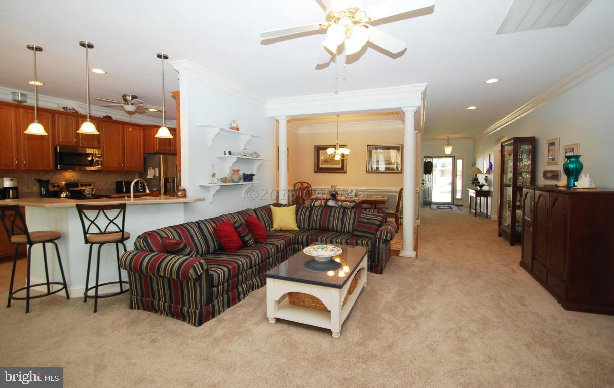 51 Pinehurst Road Ocean Pines, MD 21811 - Photo 2 of 50 a living room with furniture and a chandelier