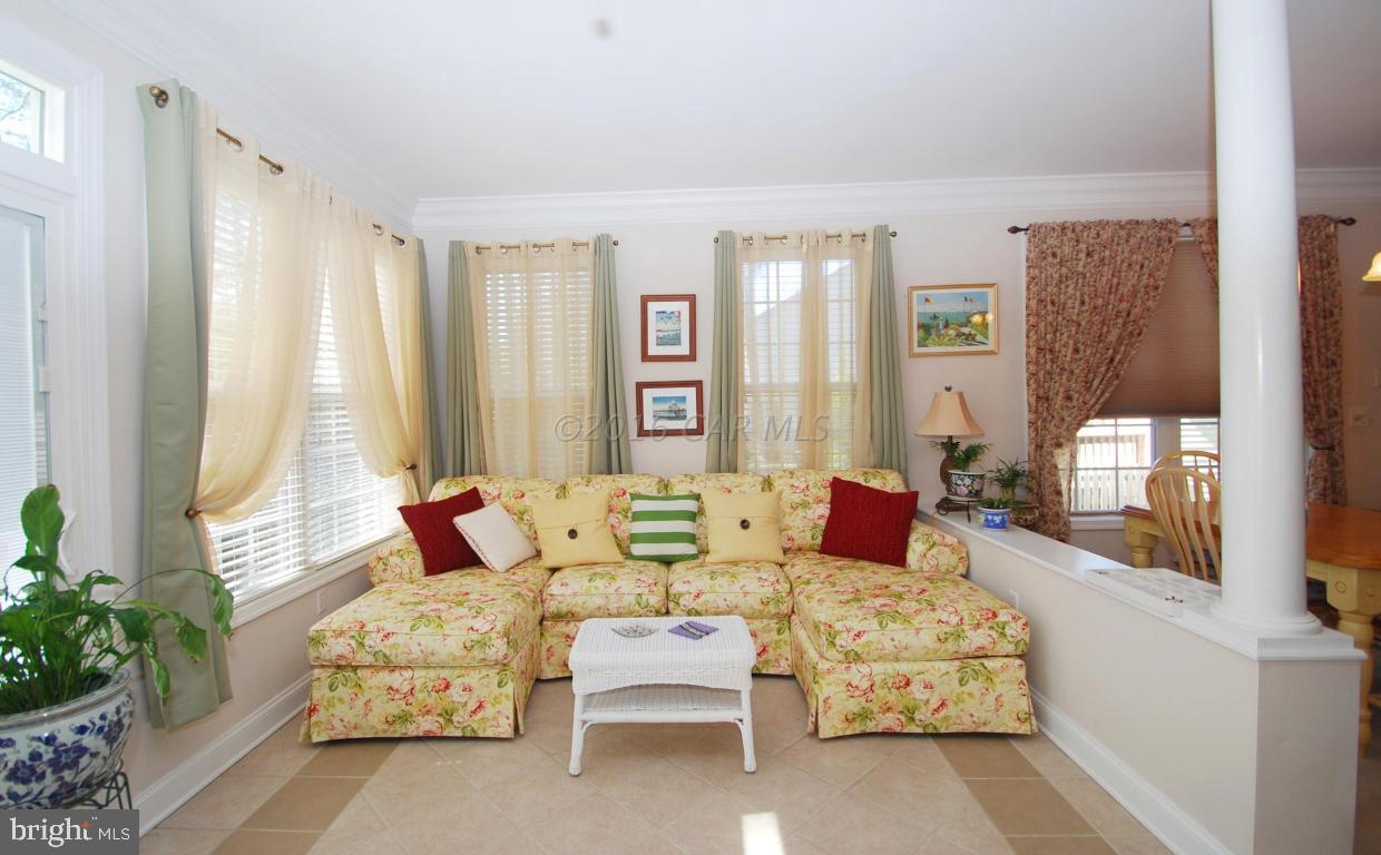 51 Pinehurst Road Ocean Pines, MD 21811 - Photo 20 of 50 a living room with furniture and a large window