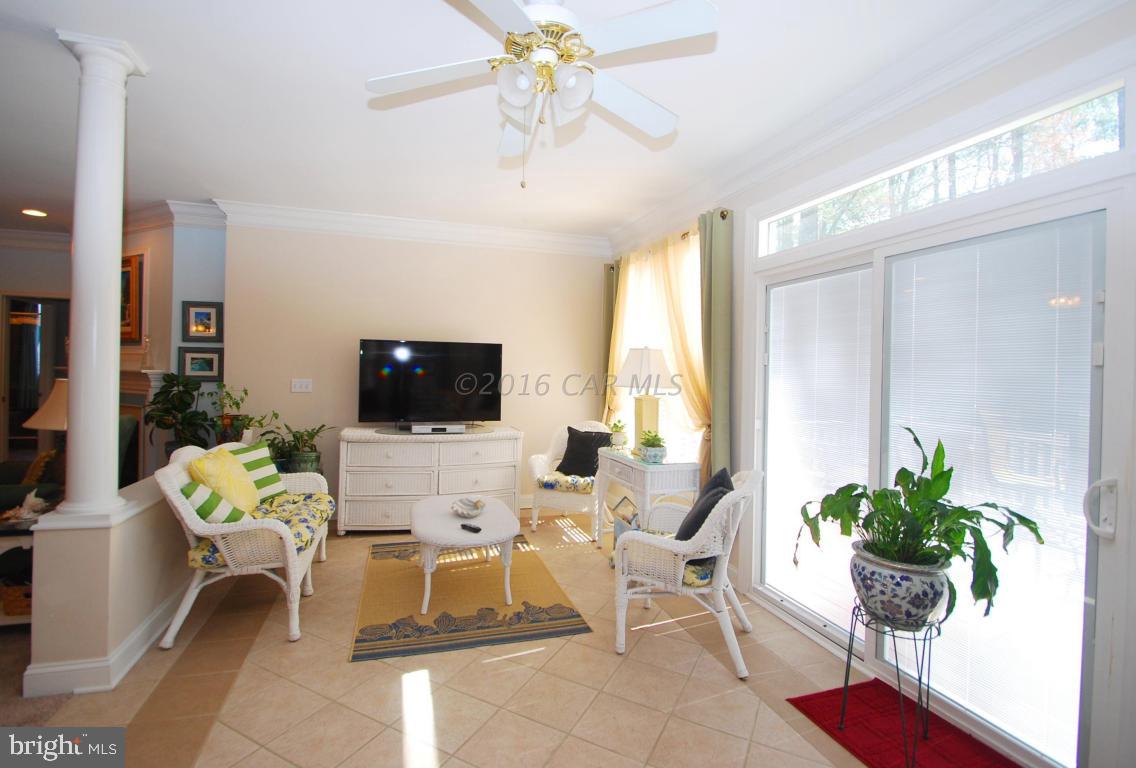 51 Pinehurst Road Ocean Pines, MD 21811 - Photo 21 of 50 a living room with furniture potted plant and a large window