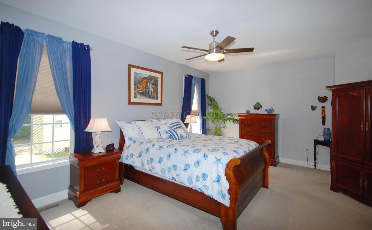 51 Pinehurst Road Ocean Pines, MD 21811 - Photo 23 of 50 a bedroom with a bed and a window