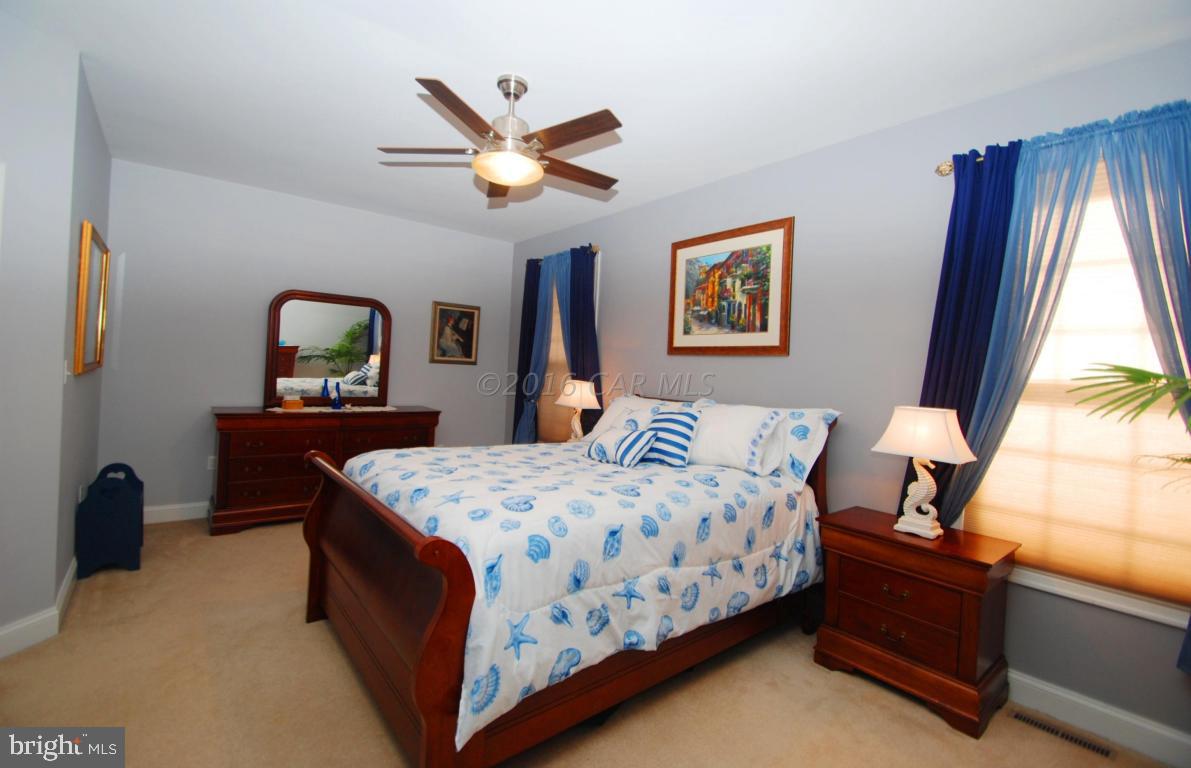 51 Pinehurst Road Ocean Pines, MD 21811 - Photo 24 of 50 a bedroom with a bed and a dresser