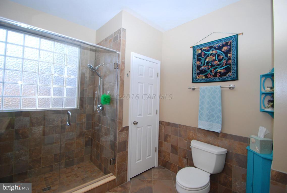 51 Pinehurst Road Ocean Pines, MD 21811 - Photo 26 of 50 a bathroom with a toilet and a shower