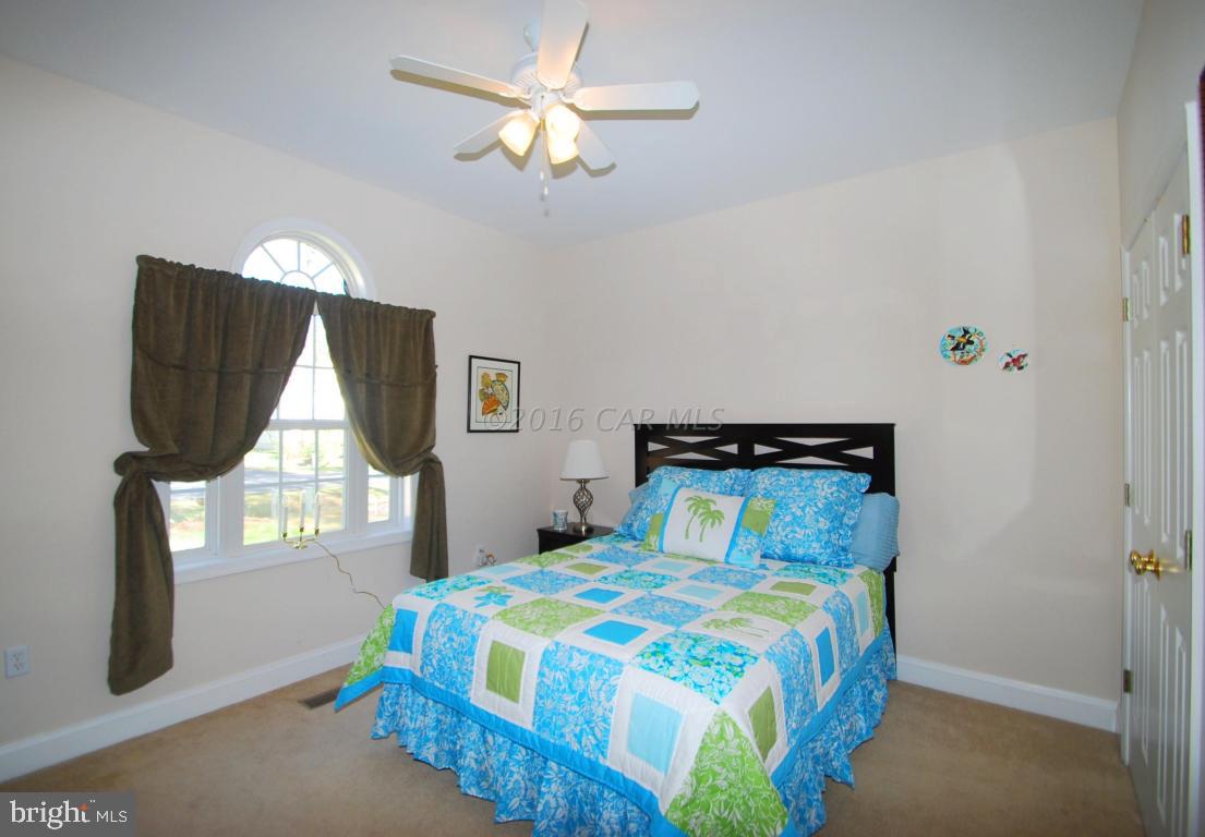 51 Pinehurst Road Ocean Pines, MD 21811 - Photo 28 of 50 a bedroom with a bed and a window