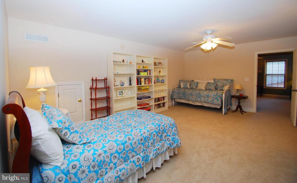 51 Pinehurst Road Ocean Pines, MD 21811 - Photo 38 of 50 a bedroom with furniture and a bed
