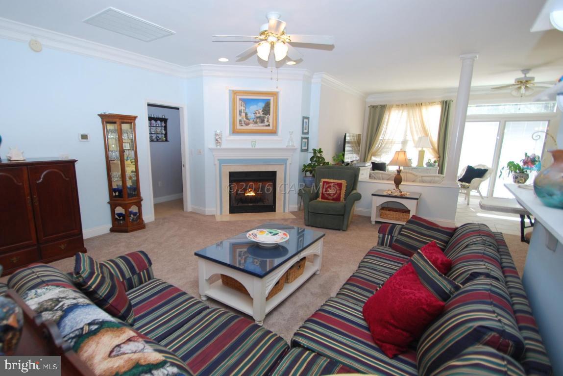 51 Pinehurst Road Ocean Pines, MD 21811 - Photo 5 of 50 a living room with furniture fireplace and a window