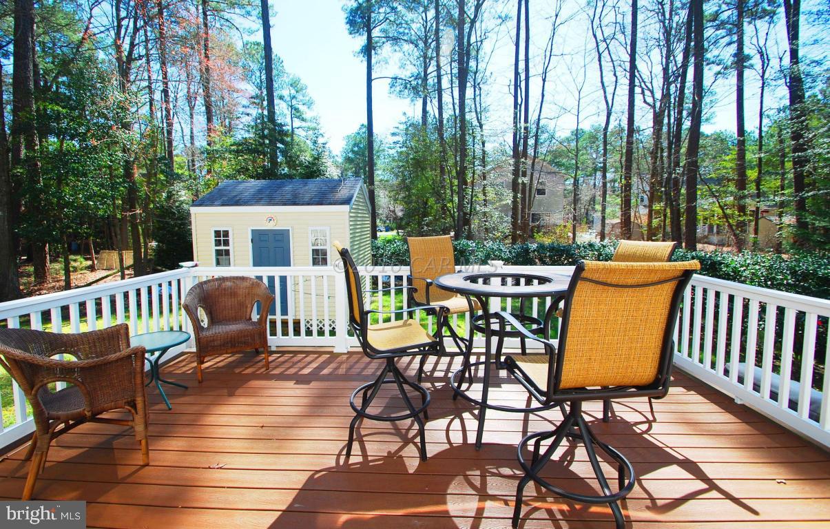 51 Pinehurst Road Ocean Pines, MD 21811 - Photo 41 of 50 a view of a patio with a table chairs and a patio