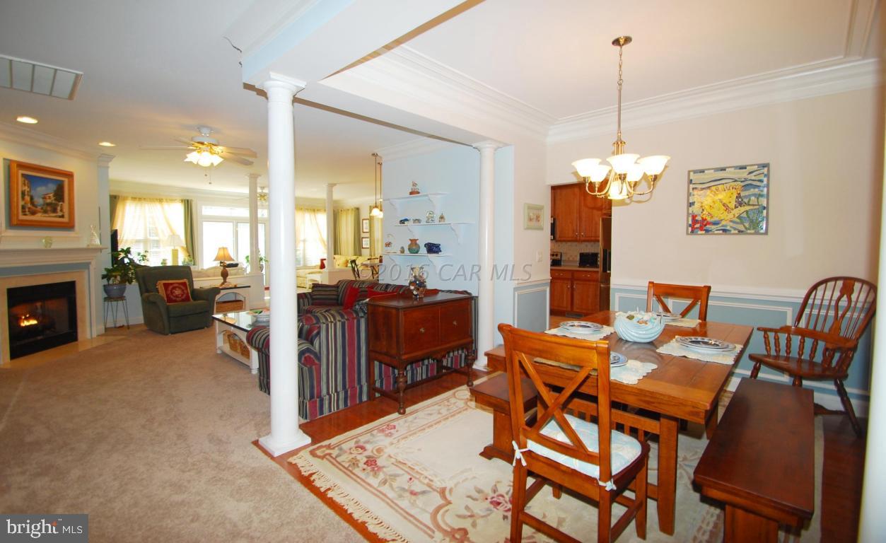 51 Pinehurst Road Ocean Pines, MD 21811 - Photo 7 of 50 a view of a dining room with furniture and chandelier
