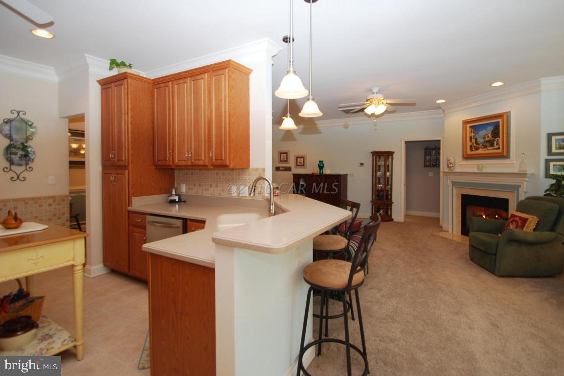 51 Pinehurst Road Ocean Pines, MD 21811 - Photo 10 of 50 a kitchen with stainless steel appliances granite countertop a stove a sink and a refrigerator
