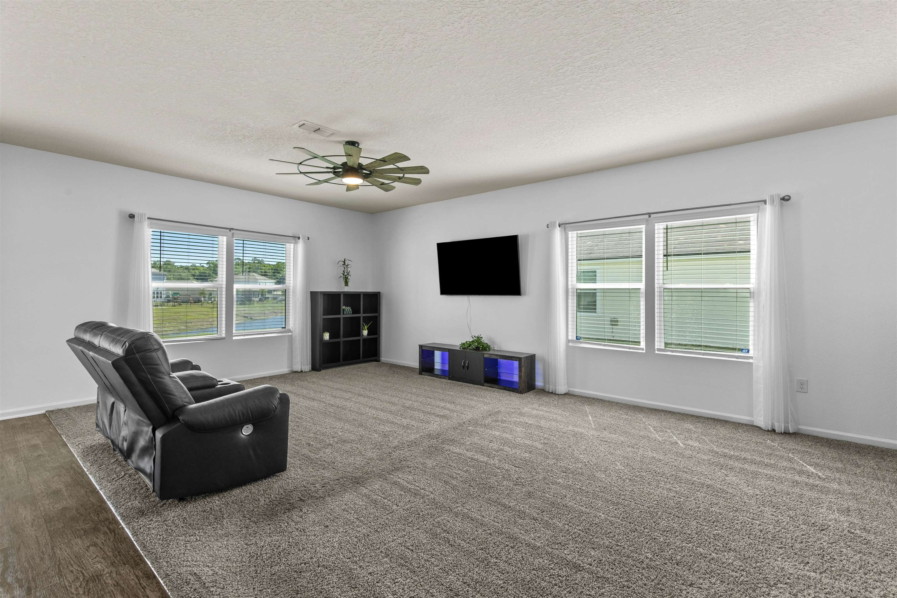 266 Caminha Road St. Augustine, FL 32084 - Photo 11 of 59 a living room with furniture and a flat screen tv