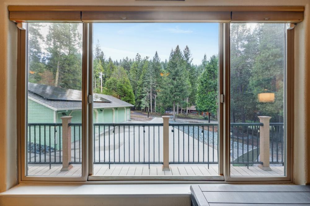 2026 Lily Valley Way West Point, CA 95255 - Photo 26 of 39 a view of a porch with a floor to ceiling window