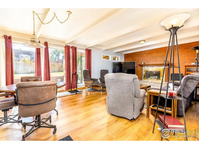 a bathroom with a granite countertop toilet sink and a mirror