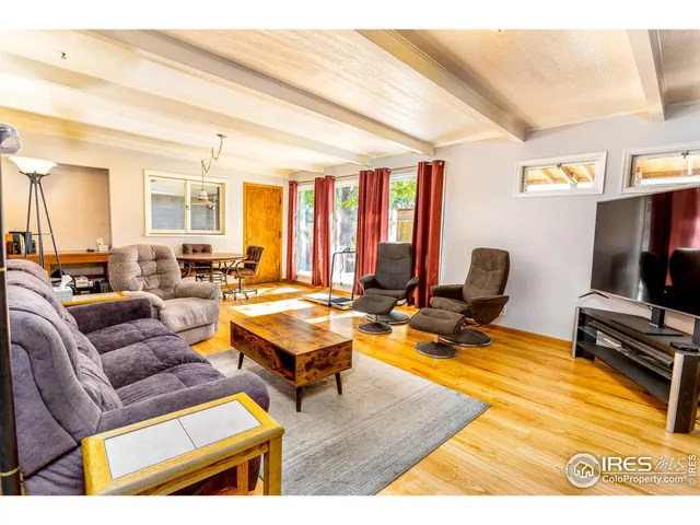 a kitchen with refrigerator and microwave