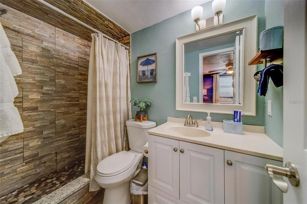 2646 Albion Street Holiday, FL 34691 - Photo 23 of 64 a bathroom with a sink toilet and shower