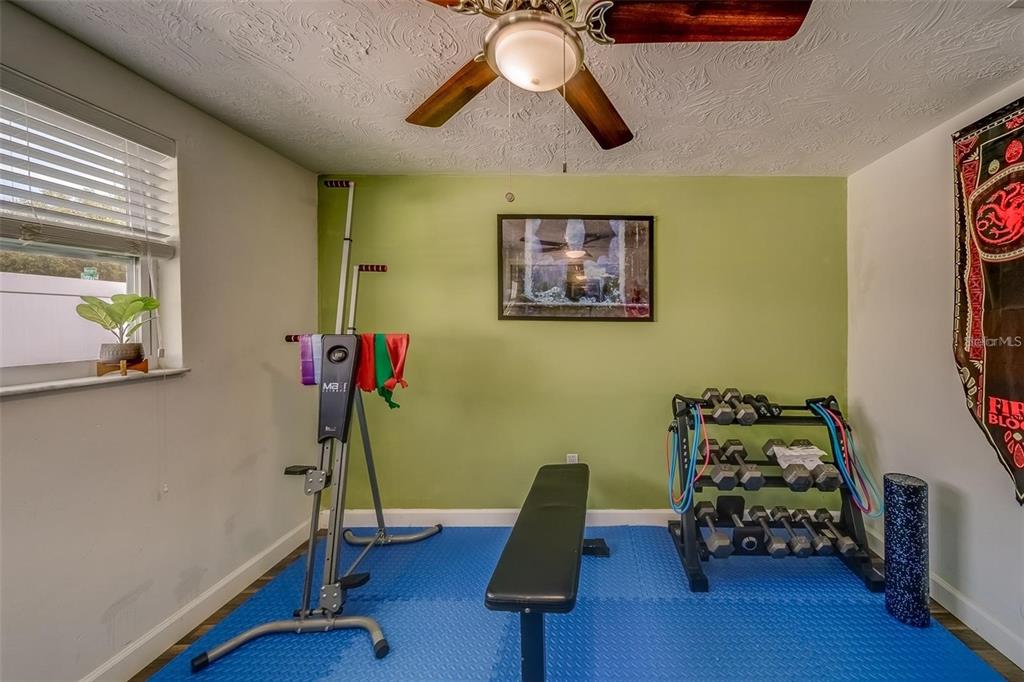 2646 Albion Street Holiday, FL 34691 - Photo 32 of 64 a bedroom with furniture and a wooden floor