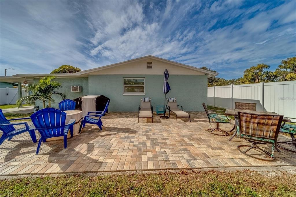 2646 Albion Street Holiday, FL 34691 - Photo 40 of 64 a backyard of a house with table and chairs