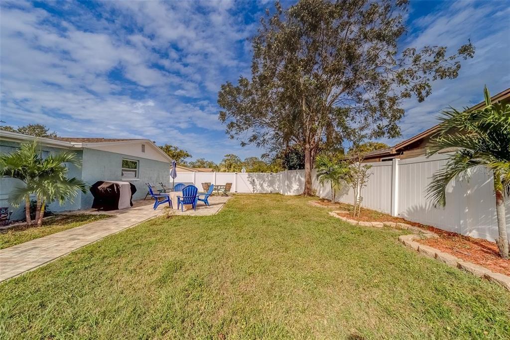2646 Albion Street Holiday, FL 34691 - Photo 45 of 64 a view of a house with a backyard and a garage