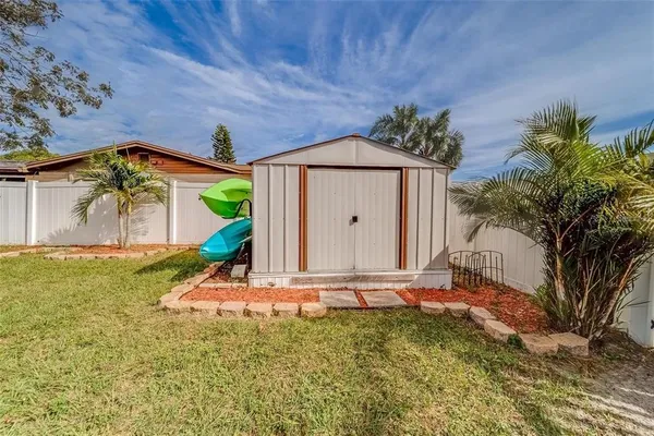 an aerial view of a house with a swimming pool and outdoor space