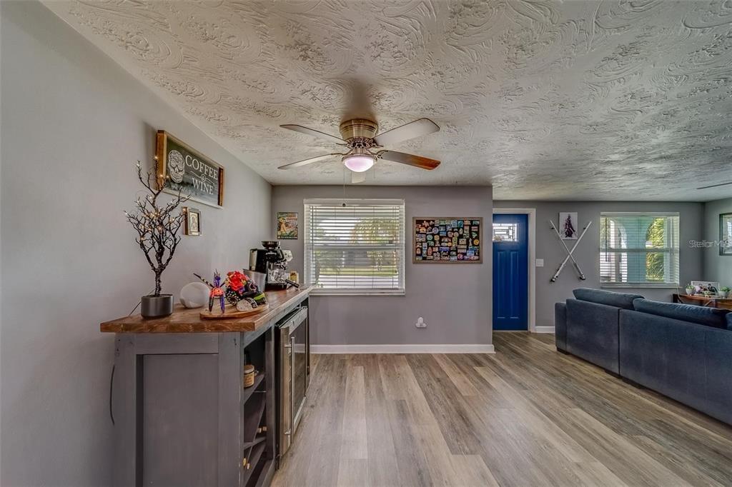 2646 Albion Street Holiday, FL 34691 - Photo 5 of 64 a view of a workspace with furniture window and wooden floor