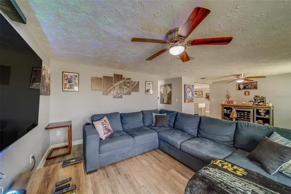 a view of a livingroom with furniture and window