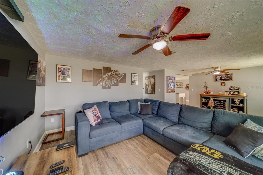 2646 Albion Street Holiday, FL 34691 - Photo 8 of 64 a living room with furniture and a flat screen tv