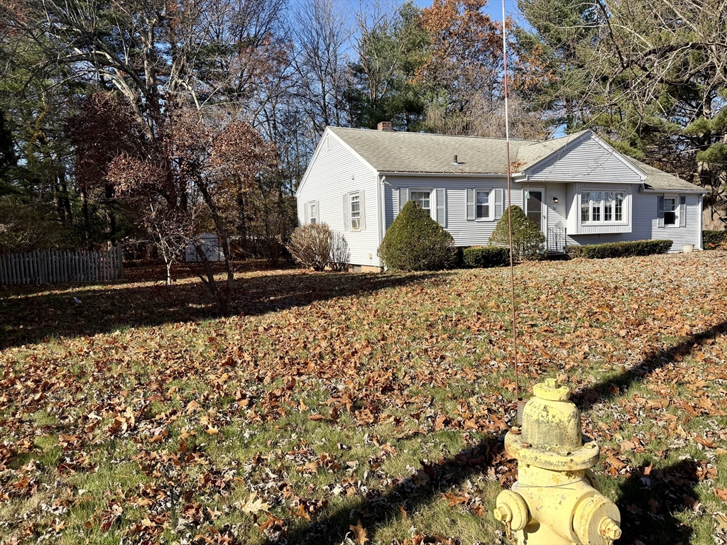 31 Pineywood Road Southwick, MA 01077 - Photo 2 of 12 a front view of a house with a yard