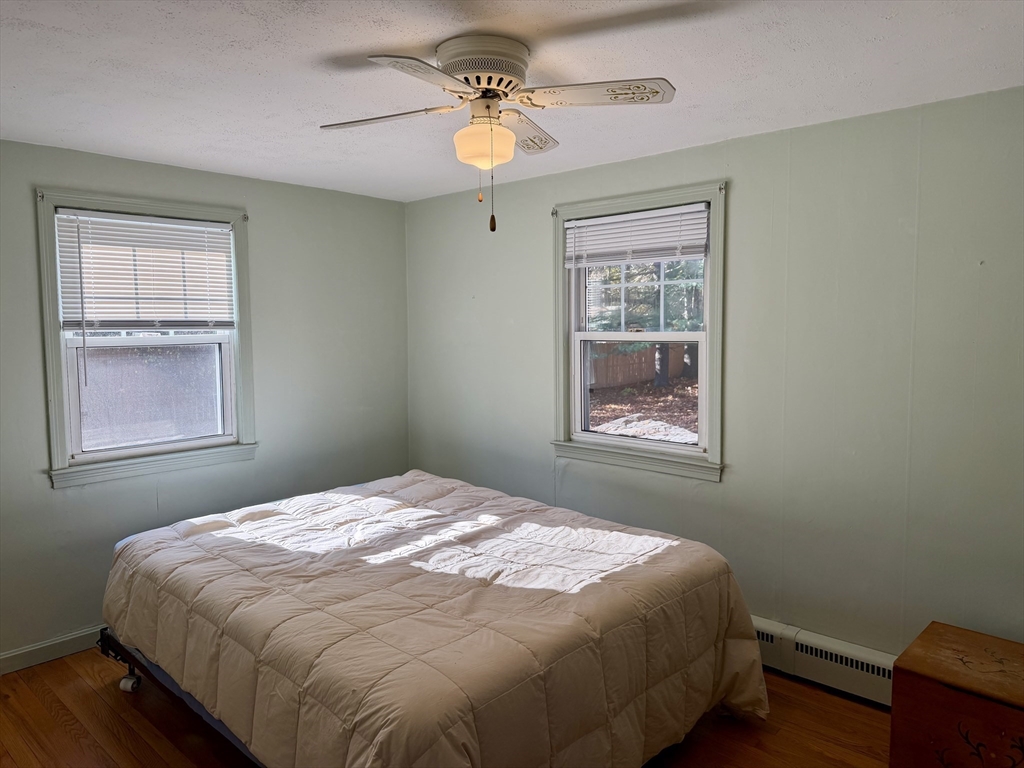 31 Pineywood Road Southwick, MA 01077 - Photo 8 of 12 a bedroom with a bed and a window