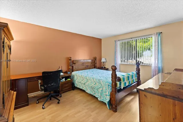 a bathroom with a sink a toilet and a shower