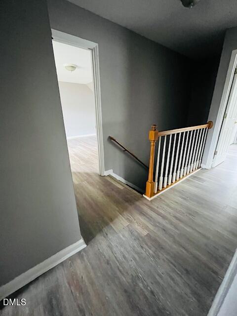 5419 Gunnette Drive Raleigh, NC 27610 - Photo 7 of 14 wooden floor in a hallway