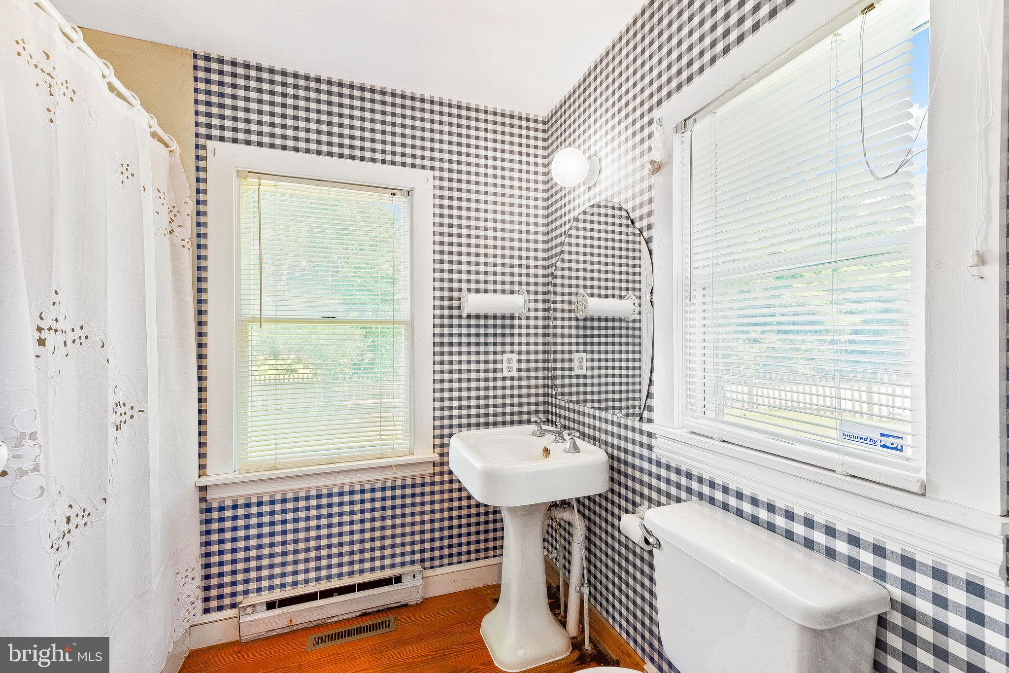 2440 Hallowing Point Road Prince Frederick, MD 20678 - Photo 16 of 51 a bathroom with a sink a toilet and shower