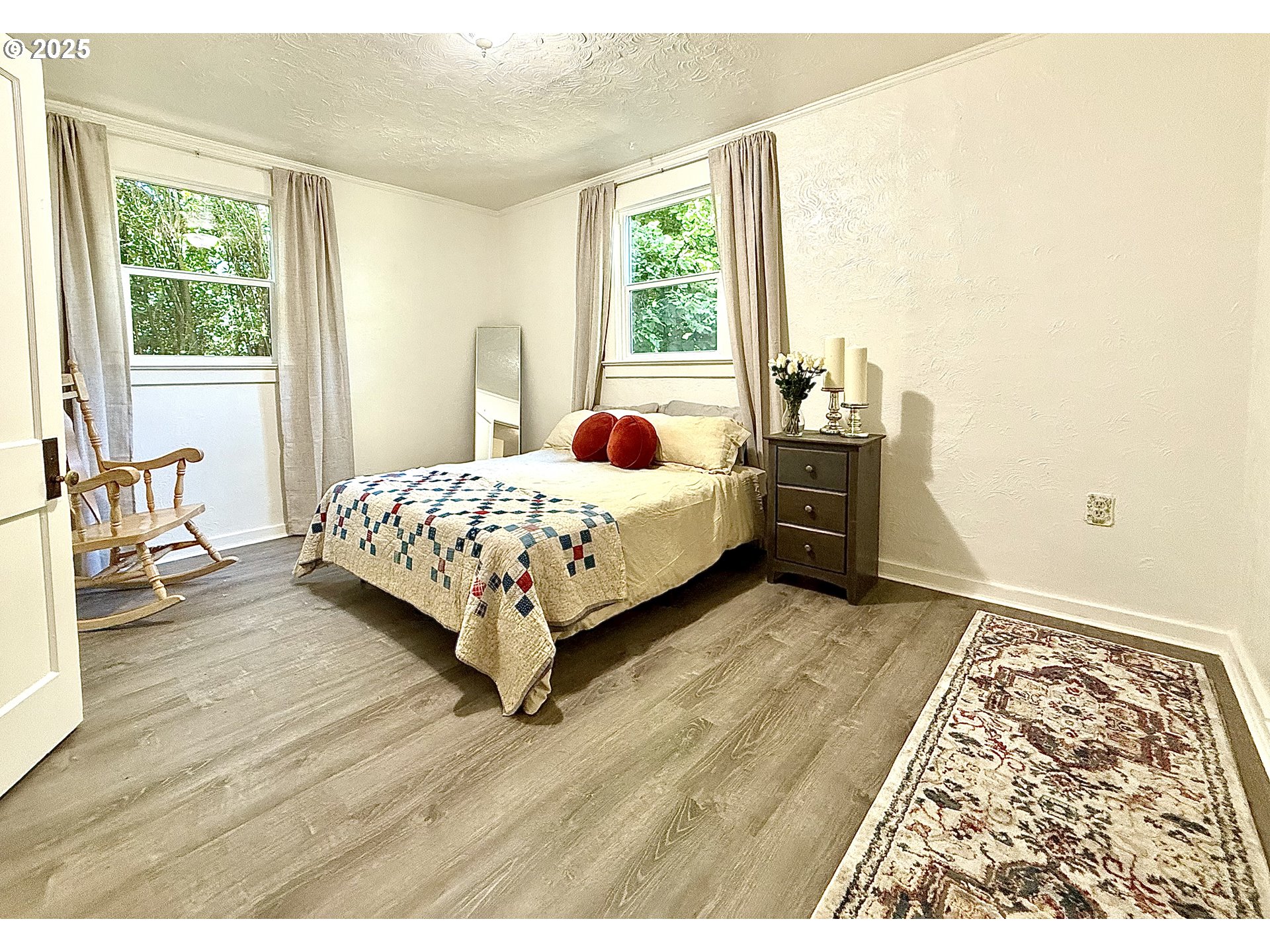 632 Southwest Utah Street Camas, WA 98607 - Photo 11 of 27 a bedroom with a bed and wooden floor
