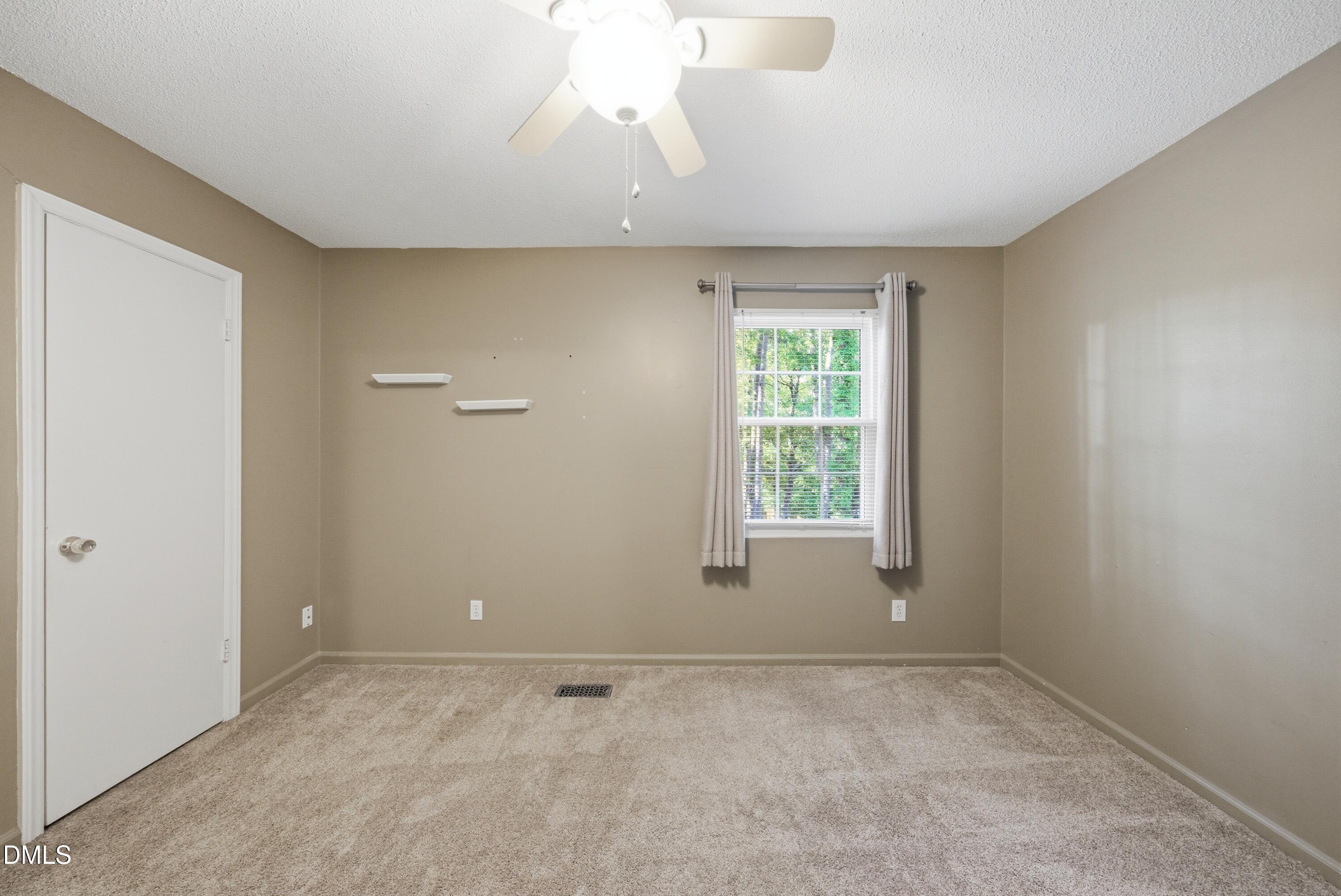 6355 New Market Way Raleigh, NC 27615 - Photo 24 of 30 a view of an empty room with a window