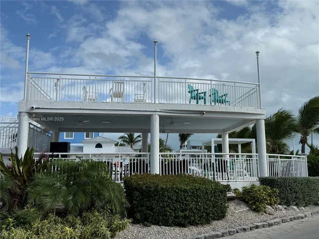 a view of swimming pool with a yard and lake view
