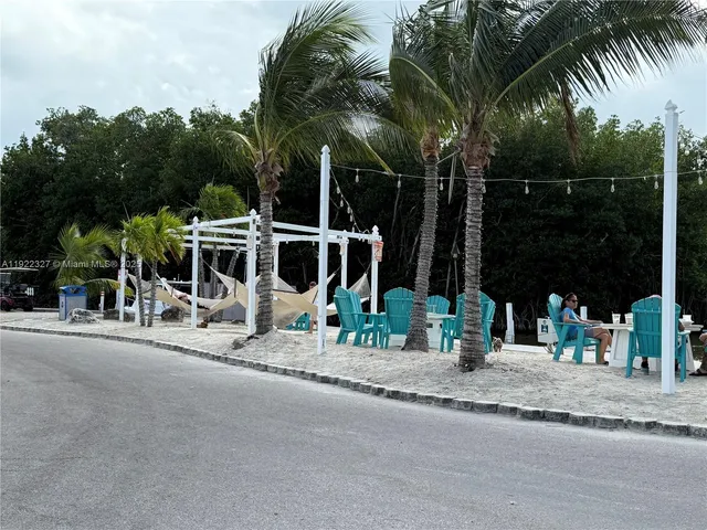 a view of a park with swings and slides