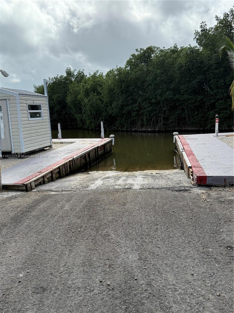 325 Calusa Street Key Largo, FL 33037 - Photo 20 of 25 a view of swimming pool with a yard and lake view