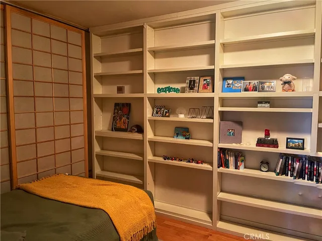 a bedroom with a bed and closet