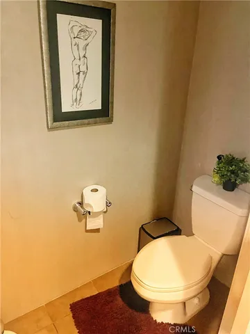 a bathroom with a toilet and a sink